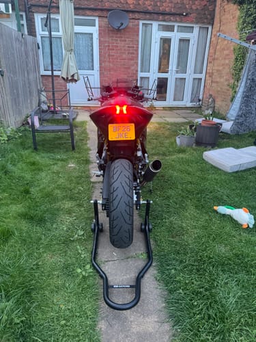 Customer's Lexmoto LXR motorcycle from the rear, showing the slim tail tidy and license plate mounted underneath the brake light.