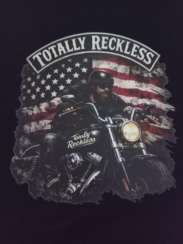 Close-up: Customer's custom biker design with a flag, printed on the black unisex t-shirt.