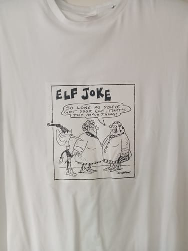 Customer's white fitted t-shirt with a black-and-white 'ELF JOKE' cartoon on the front.