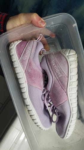 Customer's purple Wish Ⅰ Barefoot Shoes in a plastic bin, showing splotchy discoloration after washing.