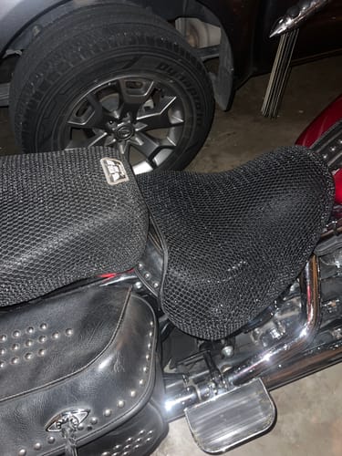 Customer's black mesh Wind Rider Seat Cover installed on a motorcycle seat, covering both the rider and passenger sections.