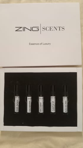 Customer's Unisex Tester Pack in its open white box, showing five small perfume vials neatly arranged inside.