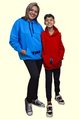 Reviewer's son wearing the red Children's College hoodie, standing next to an adult.