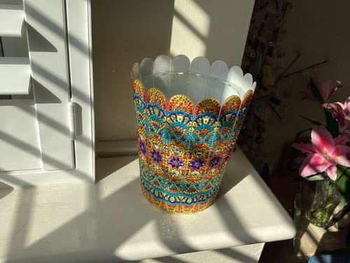 Reviewer's completed Crystal Art Joyful Blossom Flower Vase sparkling in the sunlight on a white shelf.