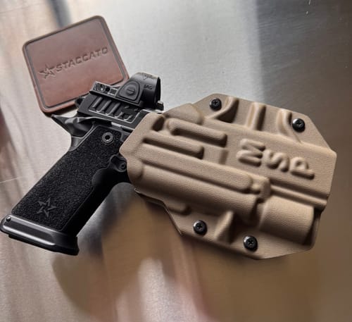 Customer's tan MSP OWB holster shown next to a black pistol with a red dot sight.