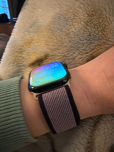 Customer's wrist showing the pink and black Trail Nylon Loop Strap on an Apple Watch.