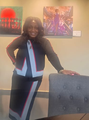Reviewer wearing the black asymmetric skirt with red and grey contrast details.