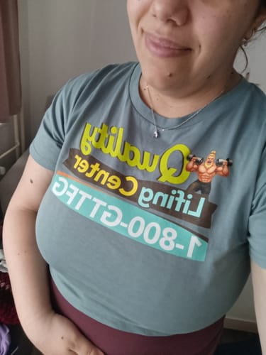 Reviewer smiling while wearing the grey Quality Lifing Center Women’s Loose Crop Top.