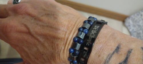 Customer showing the black We The People bracelet on their wrist.