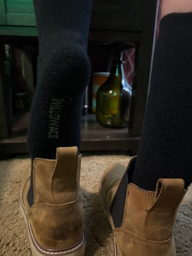 Customer wearing black Men's Alpaca Socks with tan ankle boots.