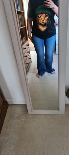 Customer's mirror selfie wearing the black Copper (Bear) Green graphic t-shirt.