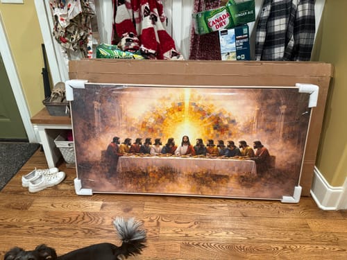Customer's large The Last Supper Faith Wall Art II canvas shown in its packaging on a wooden floor.