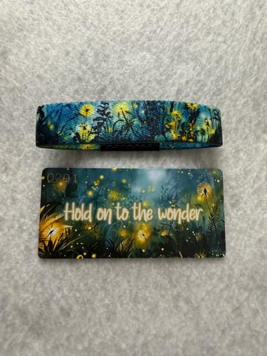 Customer's Hold on to the Wonder Bracelet and matching card, showcasing the blue and yellow night-themed artwork.