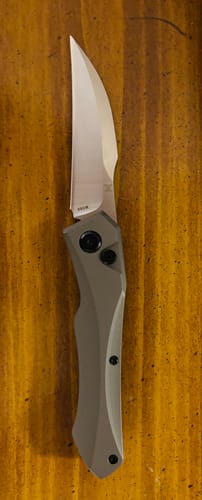 Customer's Hendrix Titanium Switchblade open, displaying the gray titanium handle and hawksbill blade.