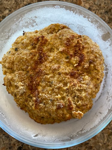 Customer's cooked ground turkey patty frozen inside a clear glass container.