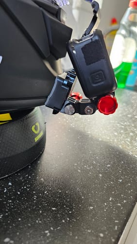Customer's close-up of the black Shoei GT-AIR 3 Camera Mount attached to a helmet with an action camera.