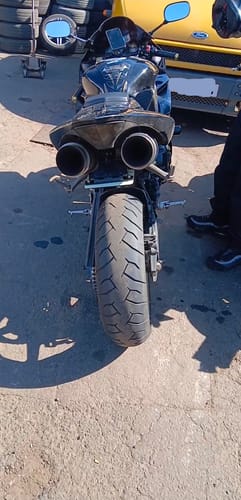 A customer's rear view of their black Yamaha R1 motorcycle, showing the minimal tail tidy installed.