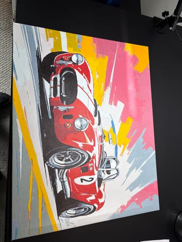 Customer's completed Classic Cobra Racer painting showing the red car against a colorful background.