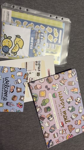 Reviewer's haul from the Sticker Subscription, showing various cute sticker sheets and a booklet.
