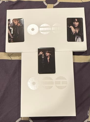 Customer's two white BTS - ARIRANG 5TH ALBUM boxes with three individual photocards displayed on top.