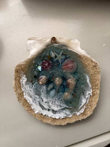 Customer's finished Keepsake Resin Half-Shell Ocean Diorama, featuring resin waves, sand, and the reviewer's own small shells.