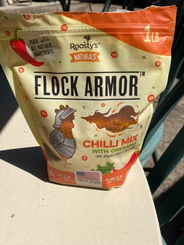 Customer's bag of Daily Deworm + Gut Support, branded as Flock Armor Chilli Mix with oregano.