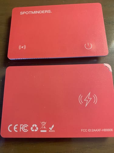 Reviewer's image showing the front and back of the red SPOTMINDERS Tracking Card.