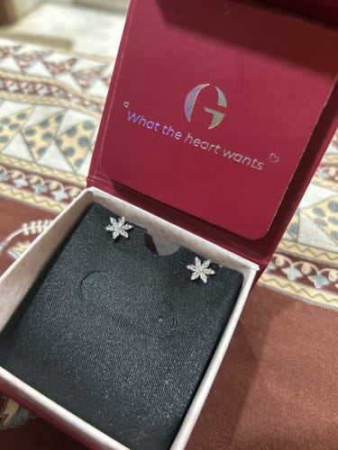Customer's Silver Flowery Snowflake Studs presented in their red jewelry box.