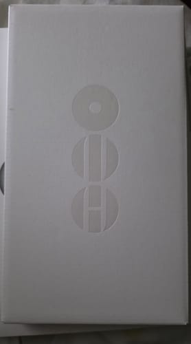 Customer's BTS - ARIRANG 5TH ALBUM in its simple white packaging, showing a clean embossed logo.