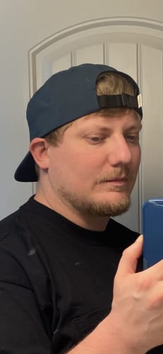 Customer wearing the Big Flat Bill Hat, showing the back view and adjustable sport strap.