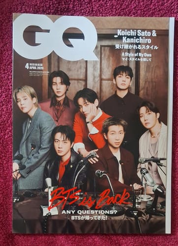 Customer's GQ Japan magazine featuring the seven members of BTS on the cover. They are in a press conference setting.