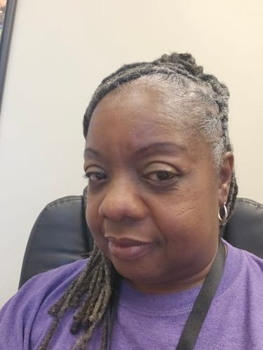 Reviewer showing her face and improved skin tone after using the Turmeric Fade & Glow Bar.