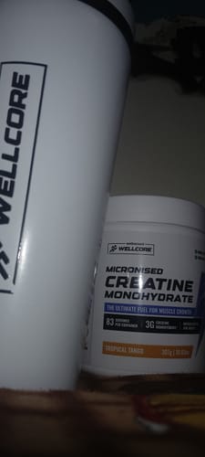 Customer's close-up of the Wellcore Creatine Monohydrate tub and the white steel shaker.
