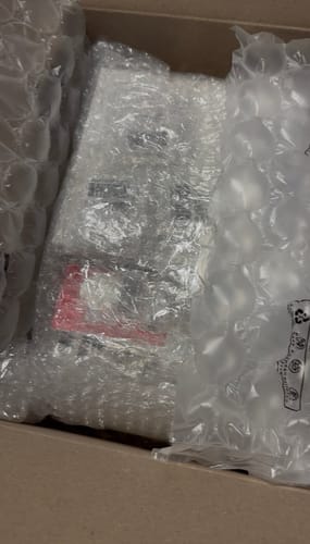 Customer's BTS Arirang album set inside its shipping box, well-protected with bubble wrap and air cushions.