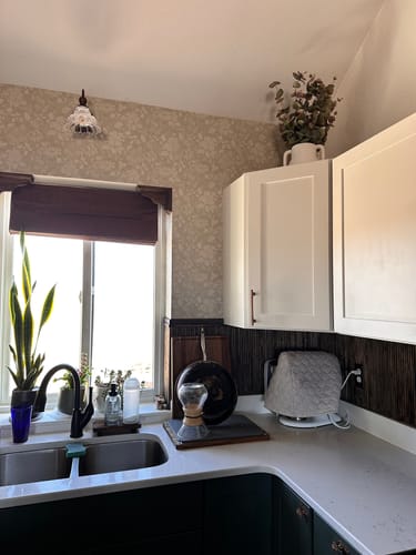 Reviewer's kitchen showing the subtle Bates Wallpaper applied to the wall above the counter and around a window.