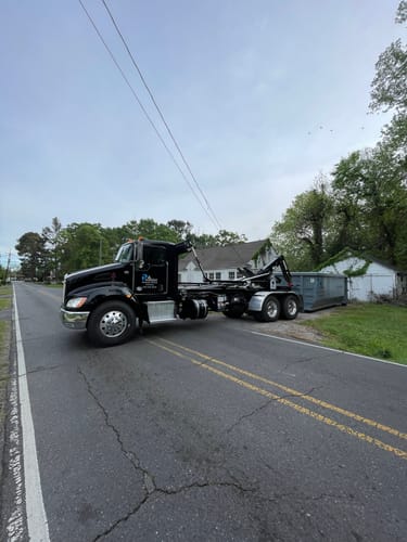 Reviewer's shiny black semi-truck after being cleaned with the Ultimate 2-Step wash.