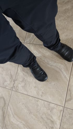 Customer's overhead view of the black Noble Ⅰ Barefoot Shoes being worn with dark pants.