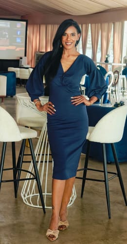 Reviewer wearing the elegant High Heels Diamond Bow shoes with a navy dress at an event.