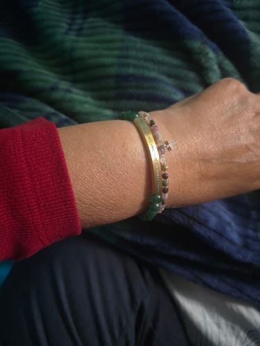 Customer wearing the YOU ARE A DIAMOND DEAR bracelet with a gold bar and colorful beads on their wrist.