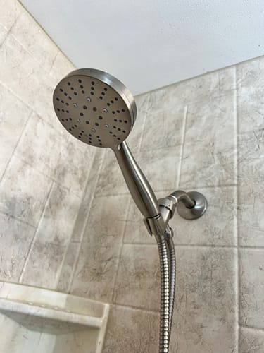 Customer's all-metal 3-Spray Handheld Shower Head Set installed in a tiled shower, showing its quality construction.