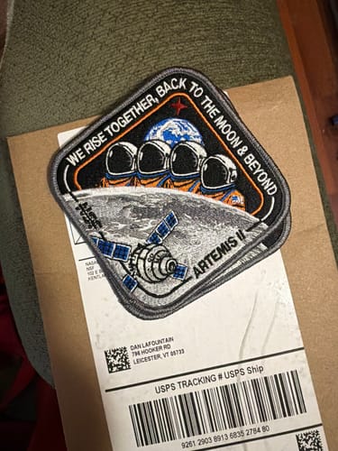 Customer's embroidered Artemis II - Collectors Patch resting on the shipping package it arrived in.