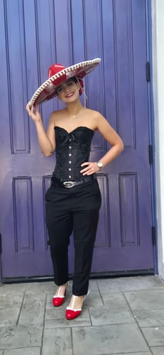 Reviewer wearing the red Retro Bow Décor High Heel Shoes as part of her prom outfit against a purple door.