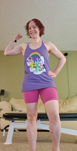 Customer flexing to show the fit of the purple Curl Bears Women's Racerback Tank.