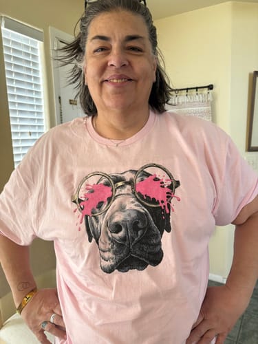Reviewer wearing the pink Pink Splash t-shirt, showing the detailed dog graphic.
