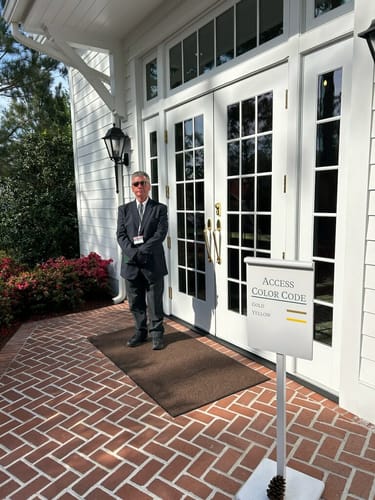 Reviewer, a security guard, standing outside wearing black Eucalyptus Lyocell Compression Socks.