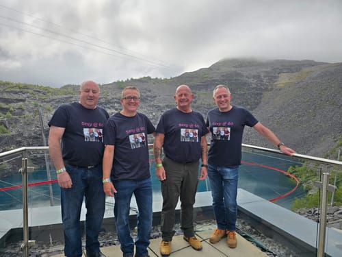 Four reviewers in matching custom Everyday tees celebrating their 60th birthdays.