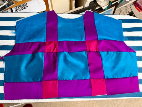 Customer's colorful dress top being made from the Pure Silk Scarves in a blue and purple patchwork design.