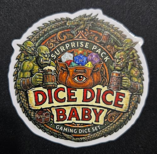Customer's 'Dice Dice Baby' vinyl sticker featuring orcs holding mugs around a bag of colorful gaming dice.
