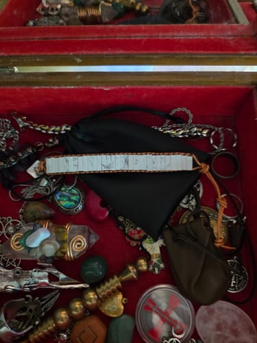 Customer's white howlite bracelet from the AuraBloom Subscription Box in a jewelry box with other spiritual items.