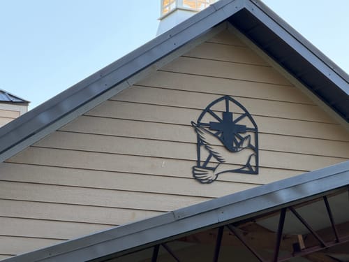 Customer photo review of #116 - Dove & Cross at Church Metal Sign
